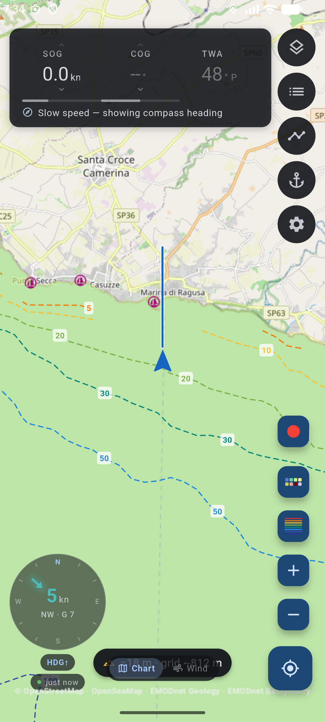 Chart helm off Marina di Ragusa: live SOG, COG, and TWA columns, heading-up wind dial, boat with heading ray over depth contours.